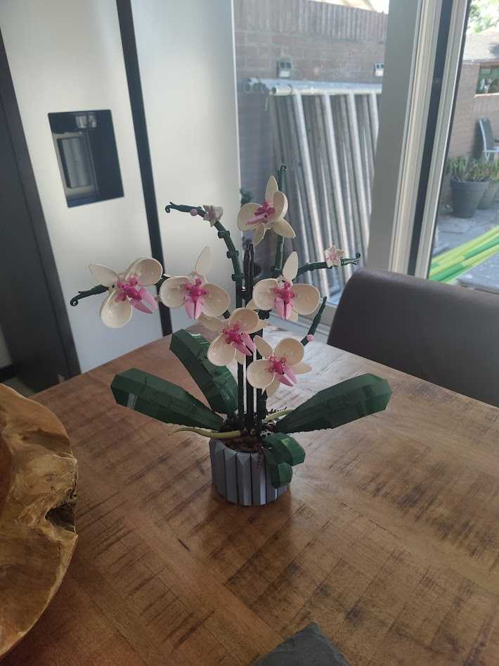 Lego orchids on a wooden table